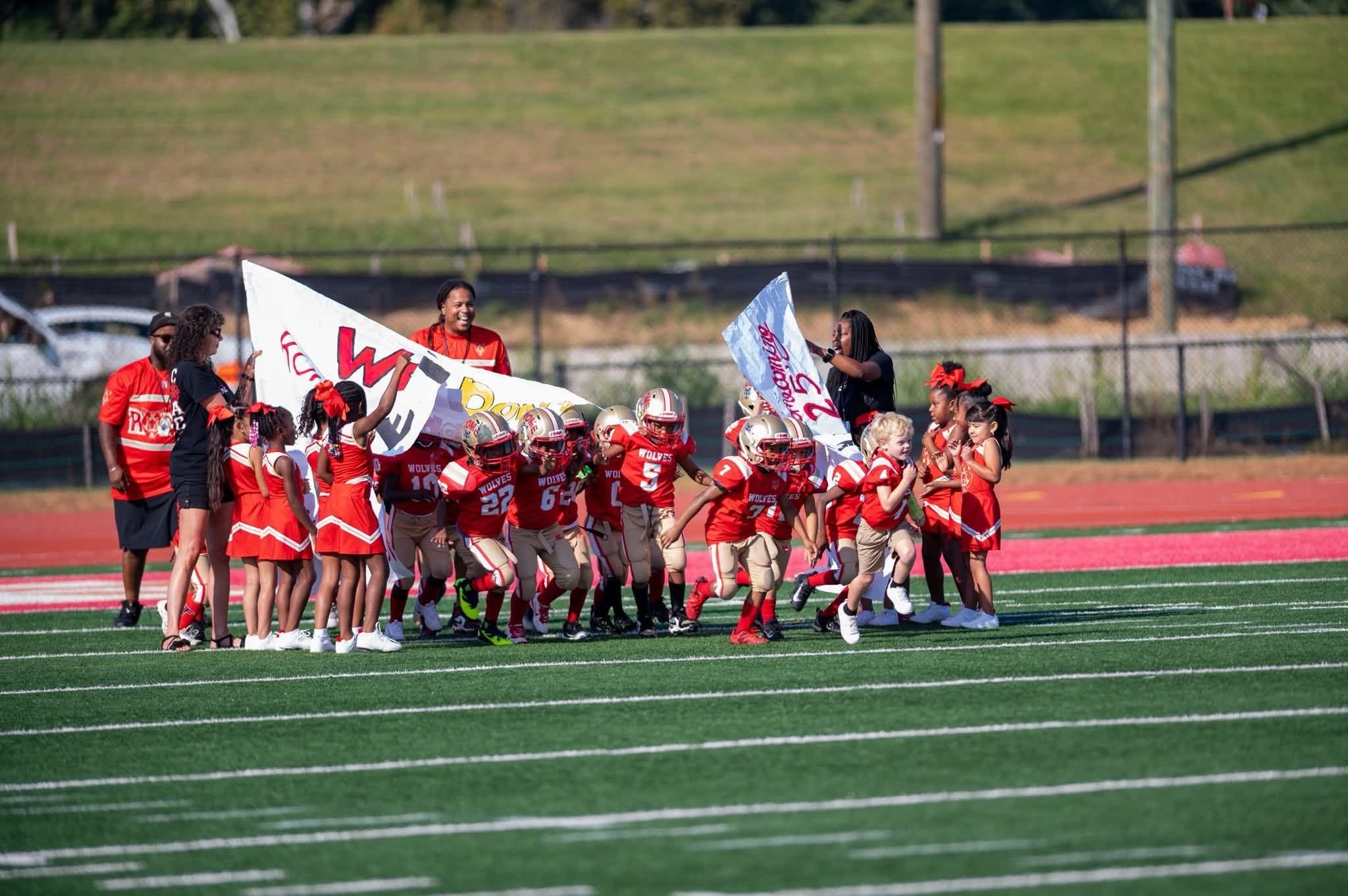 Rome Junior Wolves players taking the field
